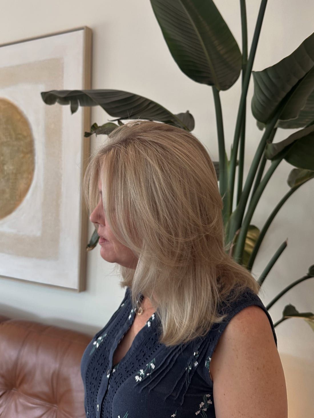 Glossy blonde hair finished with a smooth blowout at Alora Salon in Pittsburgh